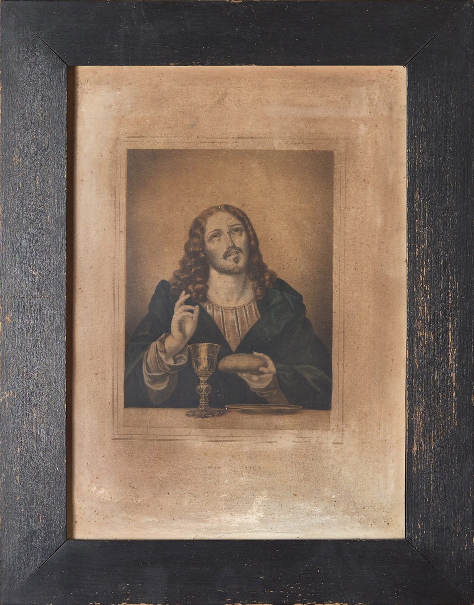 Bilde med svart treramme som viser Kristus med brødet og kalken