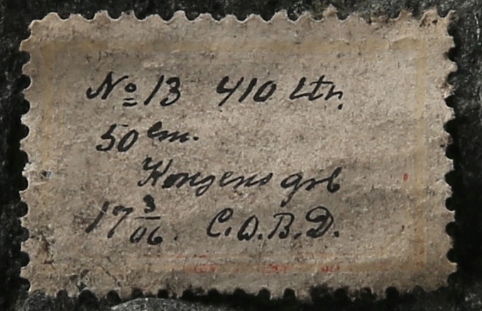 Tekst på etikett:
No 13. 410 ltr. 
50m
Kongens grb.
17/3 06 C.O.B.D.