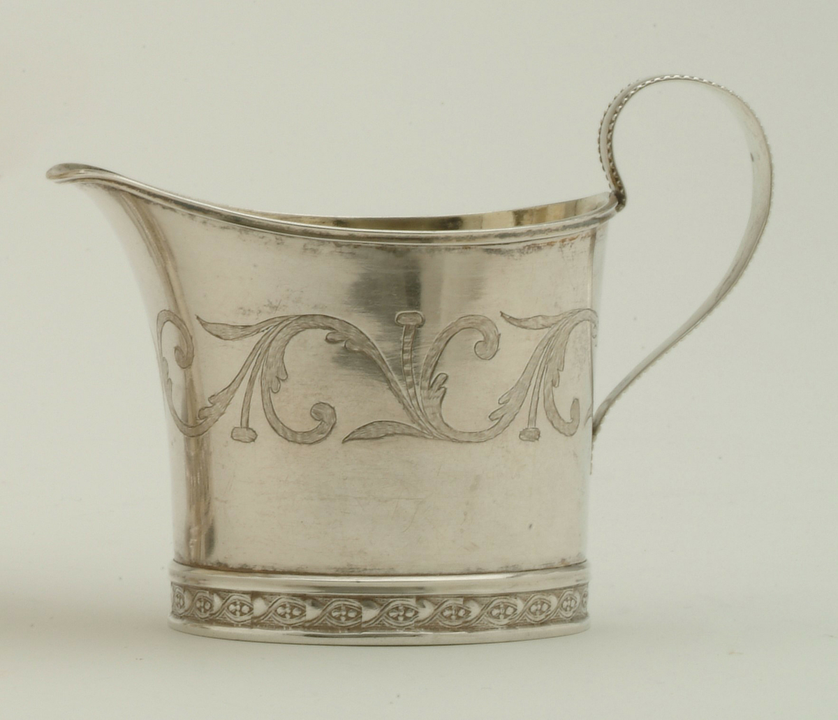 Gräddkanna i silver, tillverkad av Olof Wallin, Gävle 1815.
