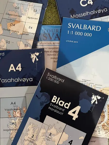 Photo shows maps of Svalbard