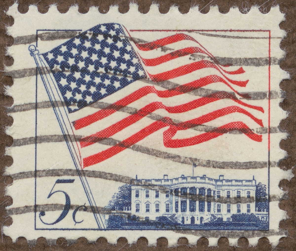 Frimärke ur Gösta Bodmans filatelistiska motivsamling, påbörjad 1950.
Frimärke från U.S.A., 1963. Motiv av Amerikanska flaggan med 50 stjärnor över "White House" -Presidentens bostad- i Washington.