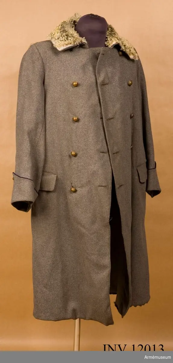 Grupp C I.
Kappa m/1910 av kläde med knappar för I 5 eller K 4.