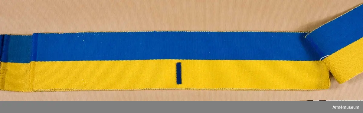 Grupp C I.
Armbindel för fältpolisen m/1898. Blå och gul. Märkt I.