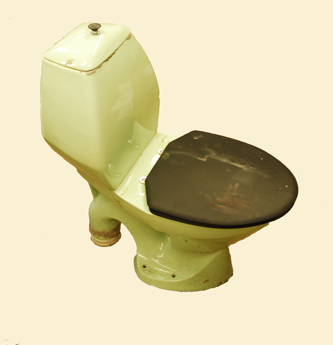 Lys grønt toalett - svart lok/kant