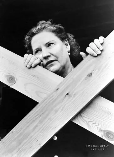 Portrait of Kirsten Flagstad leaning on the fence. Picture taken October, 28th, 1949.