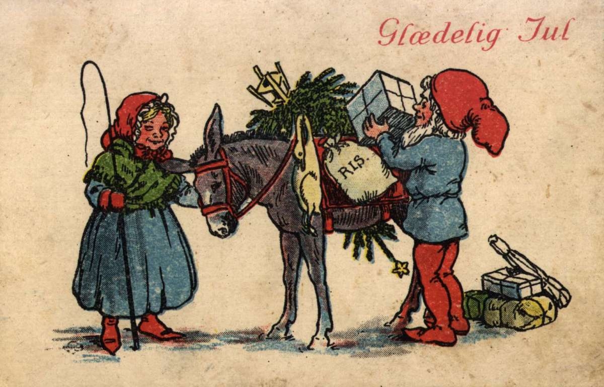 Julekort. Nyttårshilsen. Nissefar og nissemor. Esel lastet med juletre og gaver. Datert julen 1927.