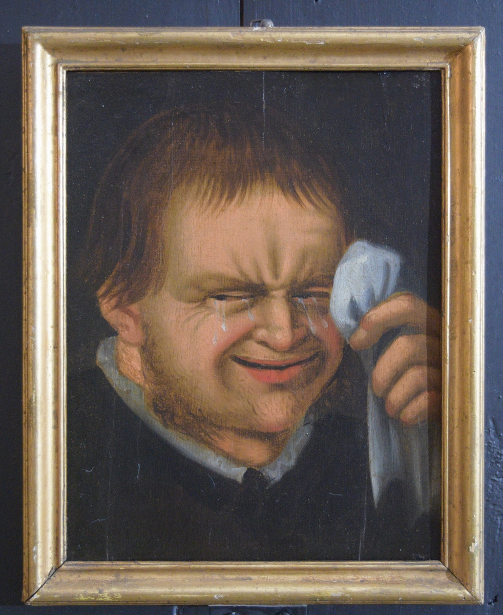 Maleriet viser et gråtende mannsansikt. Venstre hånd holder et hvitt tørkle løftet opp mot venstre øye. Av mannens klesdrakt sees bare en hvit krave tydelig.