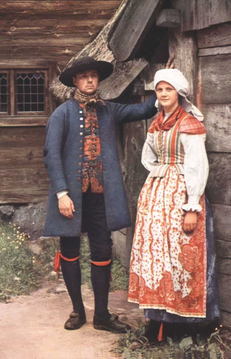 En man och kvinna i folkdräkter från Halland.