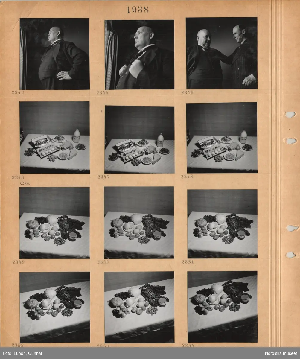 Motiv: En man, författaren Frans Eemil Sillanpää, klädd i kostym, två män samtalar, olika livsmedel upplagda på ett bord med duk.