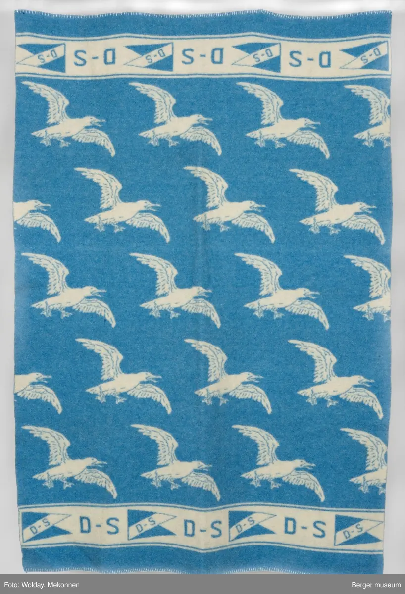 Pledd med måkemotiv