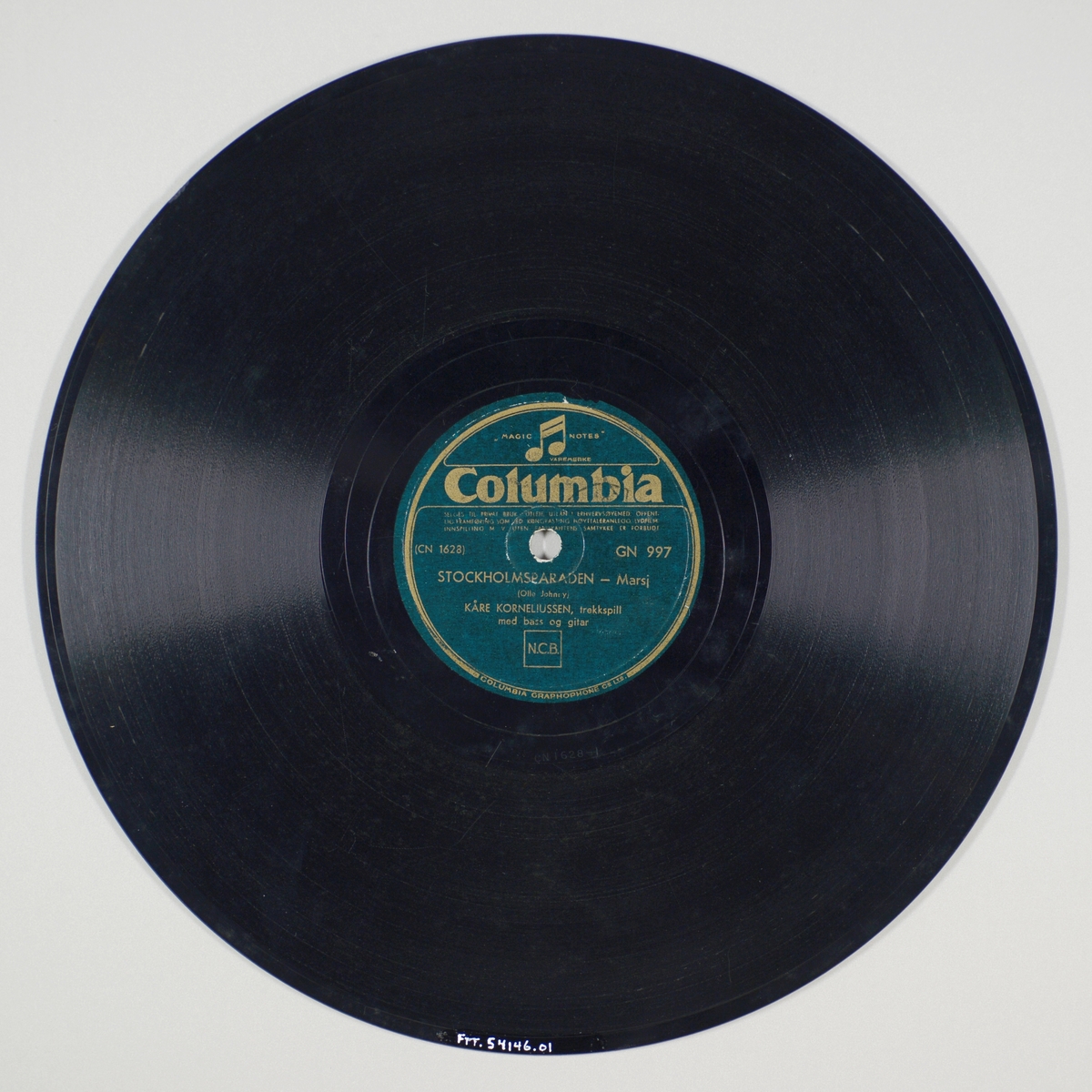 FTT.54146.01:
Svart grammofonplate laget av bakelitt og skjellak. Etiketten er mørk grønn med sølvskrift. Logoen til denne plateserien er en dobbeltnote som er øverst på etiketten.

FTT.54146.02:
Plateomslag til platen laget av papir i fargene rødt og hvitt og er identisk på begge sider. Plateomslaget er ikke originalt da det er omslaget til en Polydor-plate. På omslaget står plateselskapets navn. På forsidensiden er det trykt "Dans og underholdning. 78 omdreininger", mens det på baksiden står selskapets rettigheter. Logoen til Polydor står øverst til venstre, mens det nederst til høyre er en mannsfigur med en kontrabass og en dame foran en mikrofon.