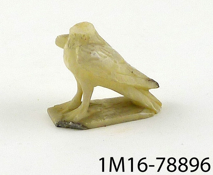 Statyett, fågel av alabaster, huvudet avbrutet.