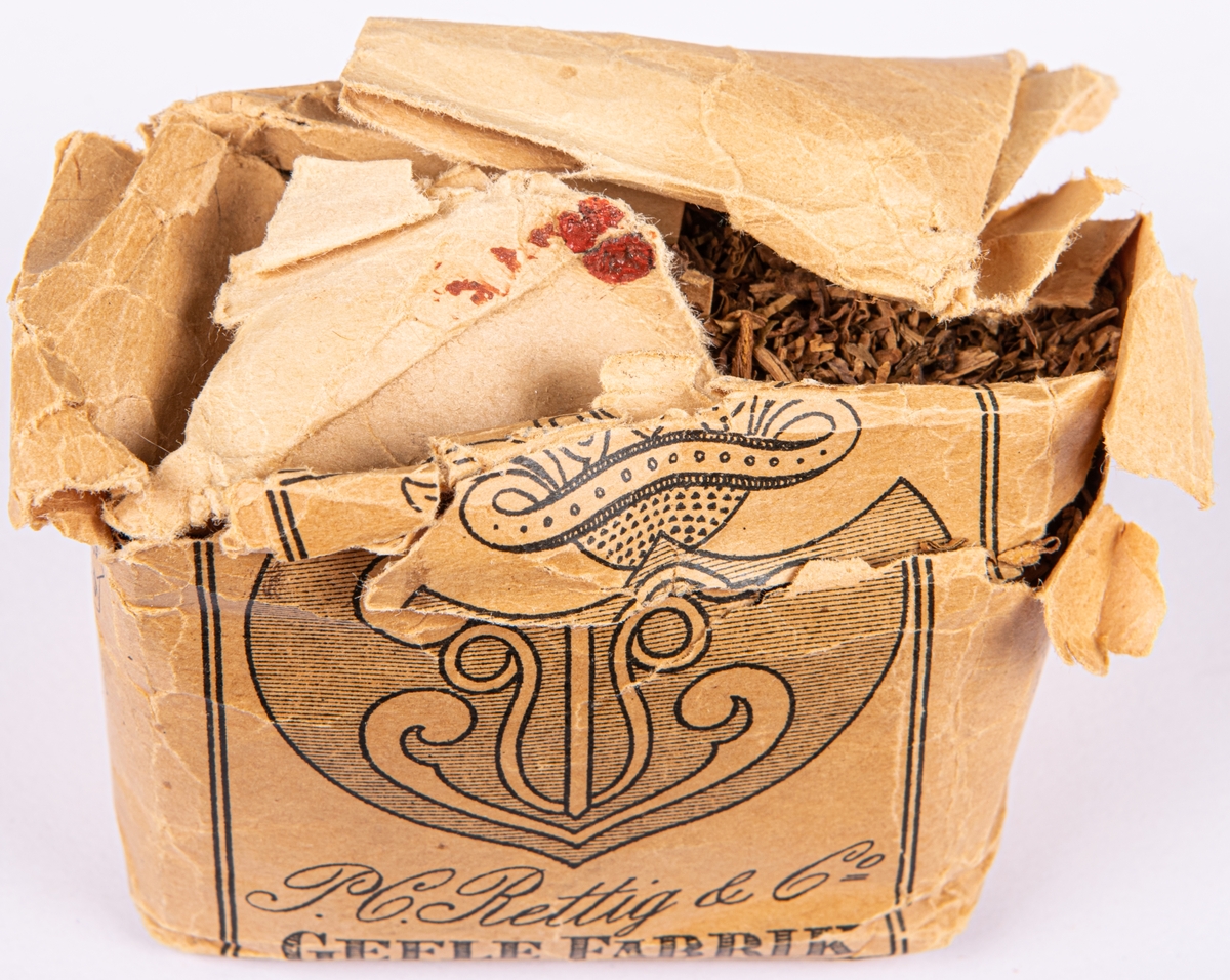 Tobakspaket, av märket: "Gefle wapen" från  Rettigska fabriken.