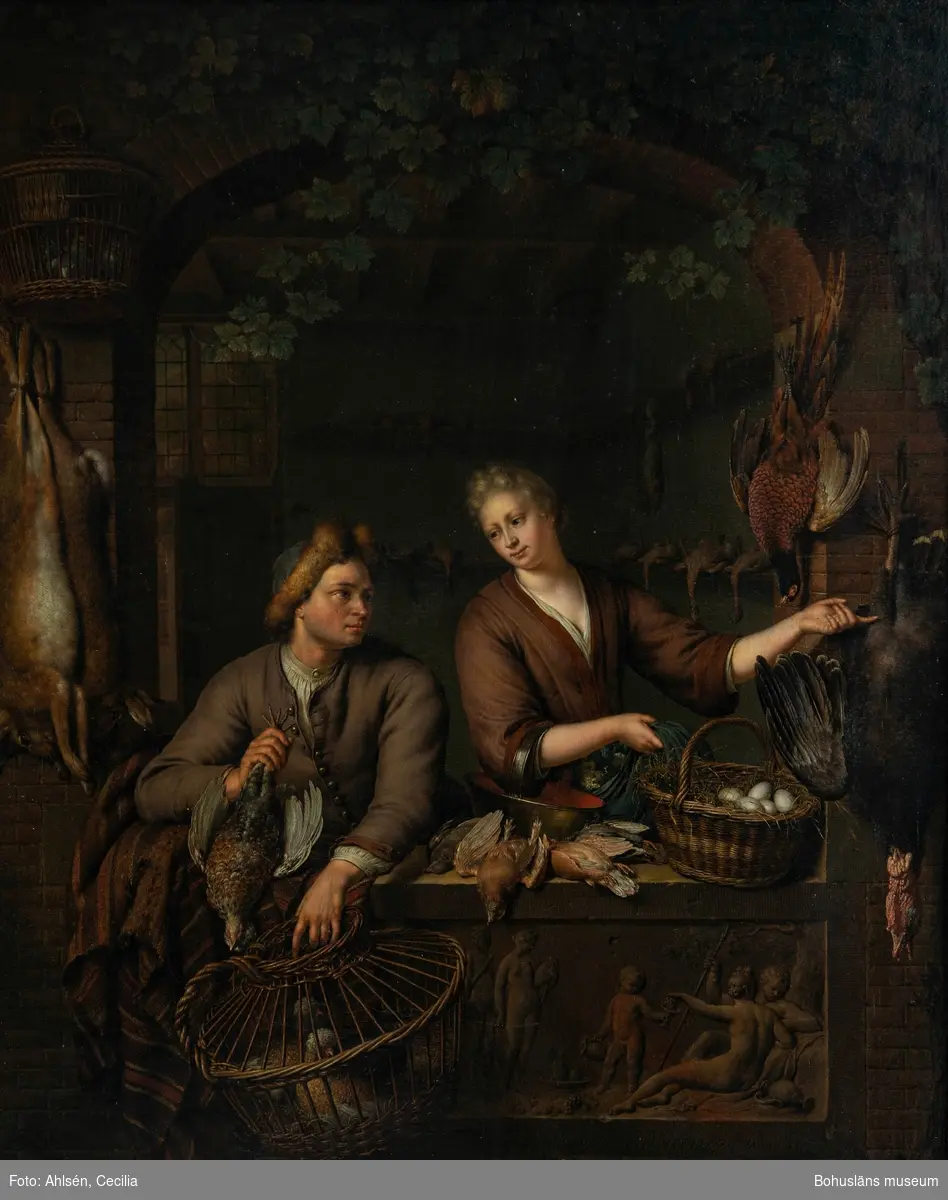 Willem van Mieris. Född i Holland 1662, död 1747.
Vilthandlaren, 1715. 45 x 37,5. Olja på träpannå.

MONTERING/RAMNING
Träpannå av ek, troligen parketterad på 1800-talet. System av vinkelställda fururibbor, varav de lodräta är limmade mot träskivan, för att motverka rörelser orsakade av förändringar i  luftfuktighet.
Mörk träram där röd grundfärg skymtar; 65,0 x 56,5 cm. Några större skruvhål i ramen. 

UPPGIFTER PÅ BAKSIDAN
Få anteckningar; två otydbara ord skrivet med svart krita/kol. Skrivet med mörk blyerts i höger övre hörn: 9 x 
På ramens nedre del en röd sigillrest ovanpå ett fastlimmat papper.
Övrig historik se JJ01.