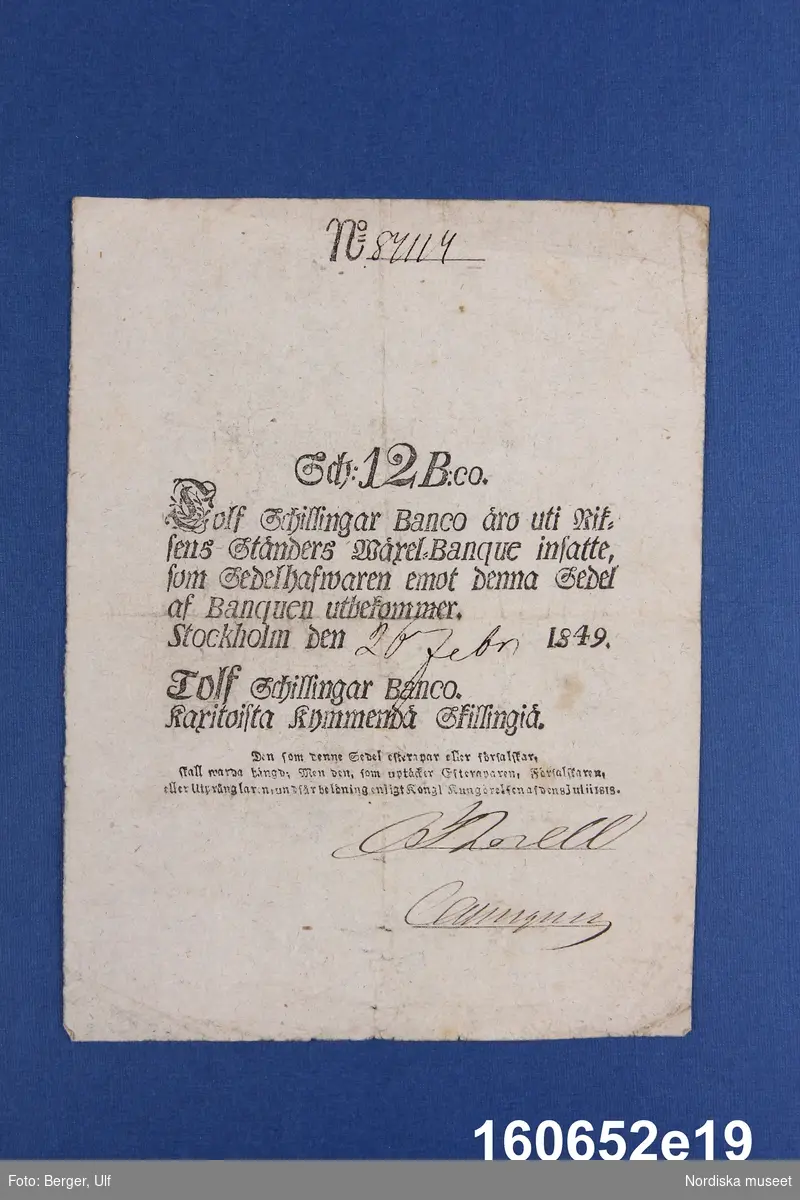 Riksens Ständers bank, 12 schillingar banco. Daterad Stockholm 26(?) febr 1849, nr 87114.