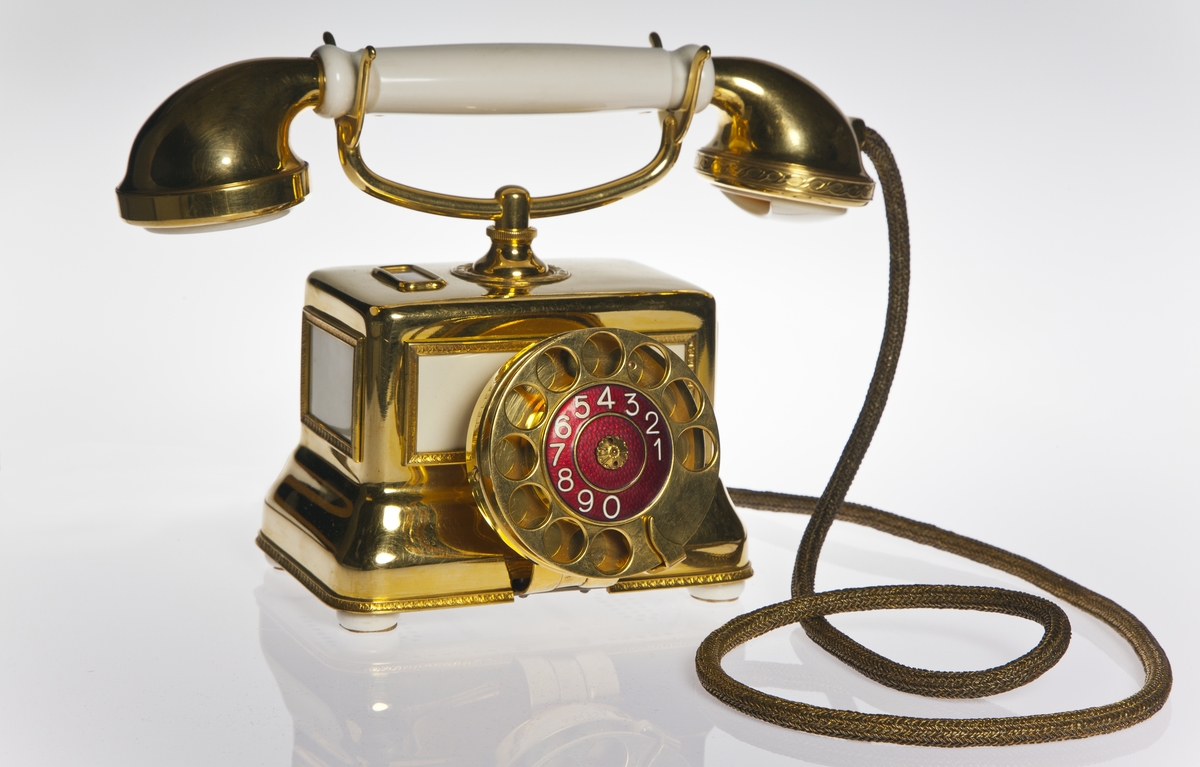 Telefonapparat,  förgylld bordsmodell av elfenben, reklamapparat, AT-system, Wincrantz-apparat.