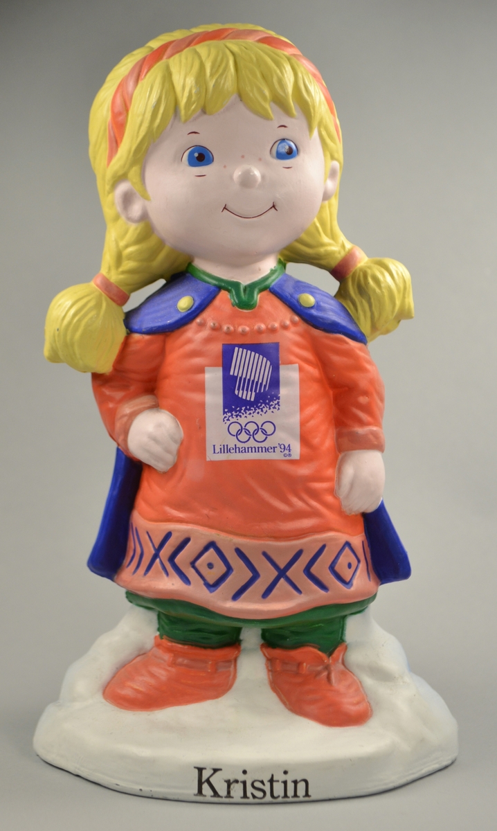 Bøssa er forma som Kristin som var maskot, OL på Lillehammer 1994.