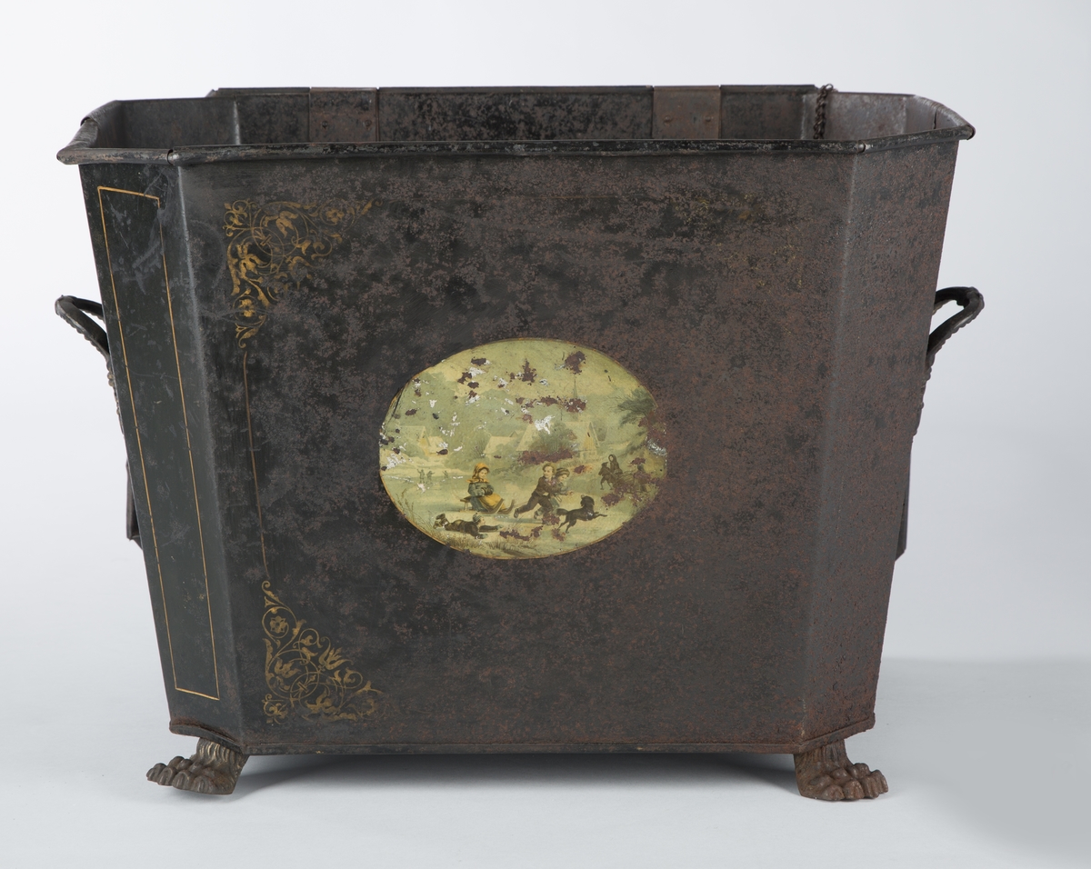 Liggende, ovalt motiv av lekende barn i vinterlandskap.