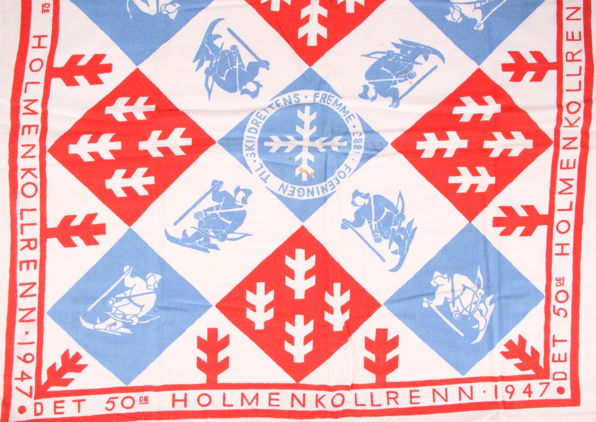 Offisielt skjerf laget til Holmenkollrennene i 1947 dekorert med tekst samt deler av snøkrystaller og "fuglemannen" fra Skiforeningens logo.