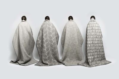 Kristine Five Melværs fire Naturpledd, designet for Røros Tweed. De fire pleddene, med ulike mønstre, henger over fire rygger (Foto/Photo)