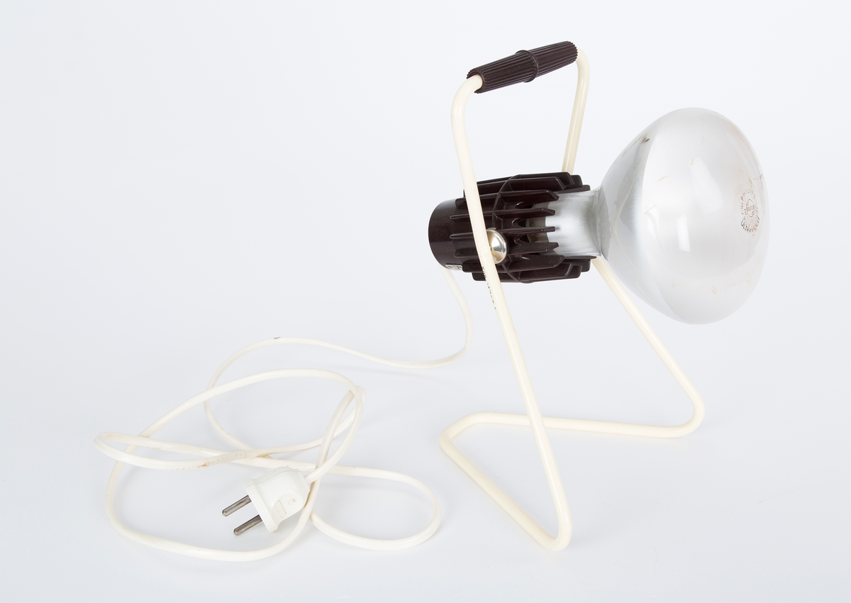 Lampe med UV-pære for kunstig soling. Ligger i originaleske med prislapp kr. 95.