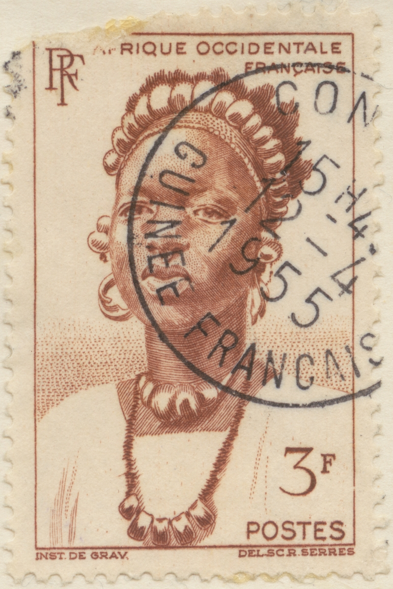 Frimärke ur Gösta Bodmans filatelistiska motivsamling, påbörjad 1950.
Frimärke från Franska Västafrika, 1947. Motiv av kvinna med huvudbonad och halsprydnader: Djenné (Togo).