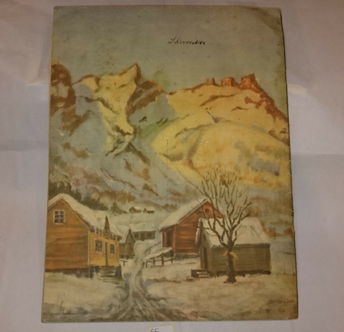 Julehefte frå 1941, Evangelisten. Framside har naturmotiv med eit lite uthus og ein mann som går på ski. 
Basksida har ei teikning av eit gardstun.